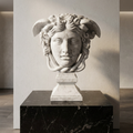 Medusa Rondanini marble head on a dark plinth